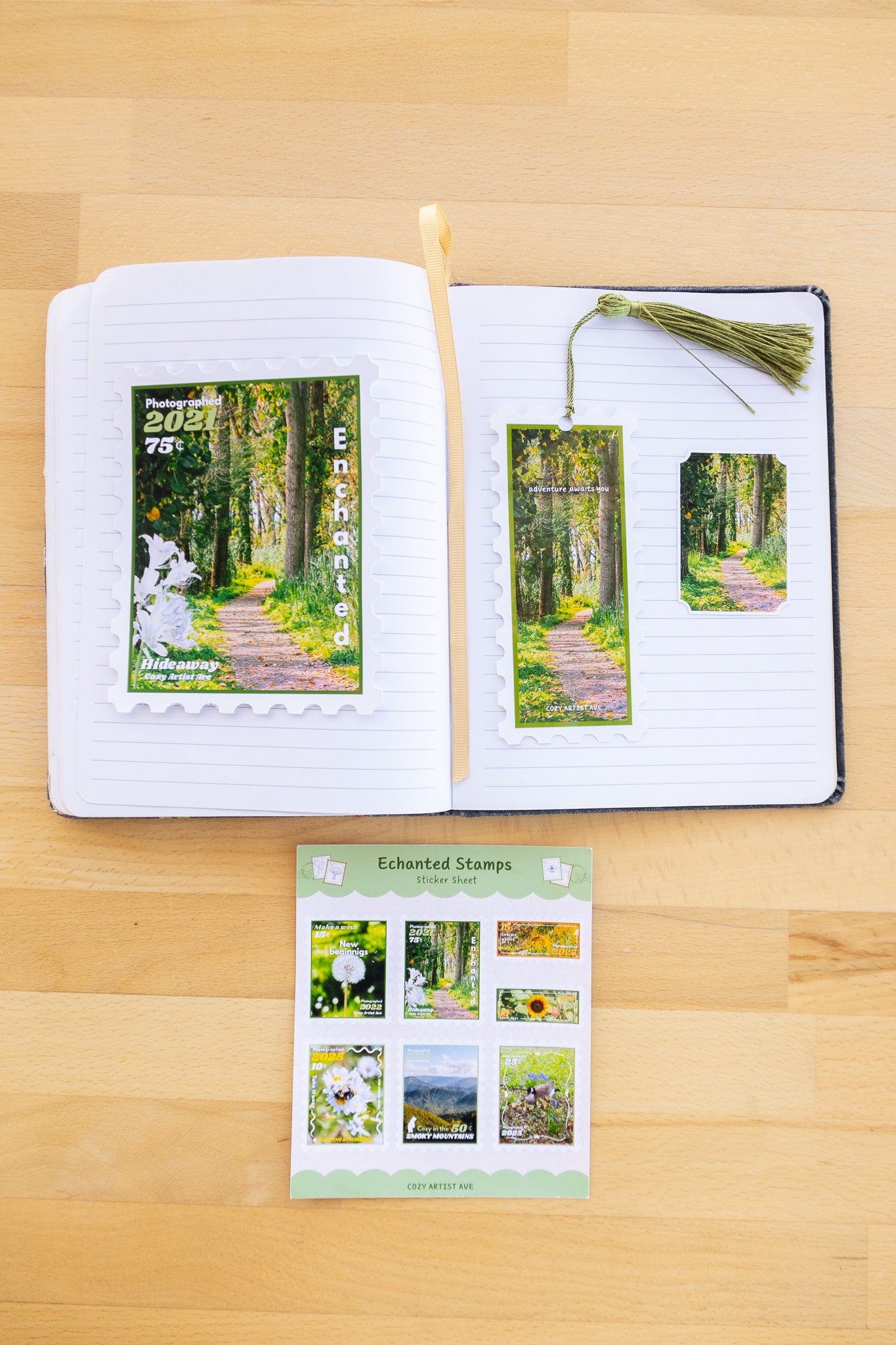 Open notebook with nature-themed stamps on a wooden surface